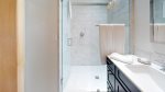 Marble tiled walk-in shower